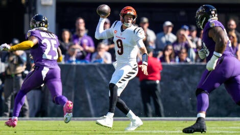 Cincinnati Bengals quarterback Joe Burrow (9) scrambles in the first quarter of the NFL Week 7 game between the Baltimore Ravens